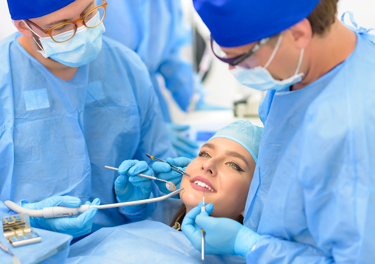 Woman having dental surgery