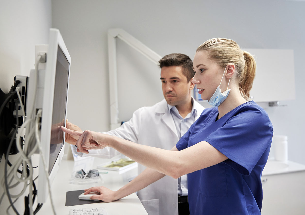 Dentists examining the x ray report - Dentist in West Chester PA