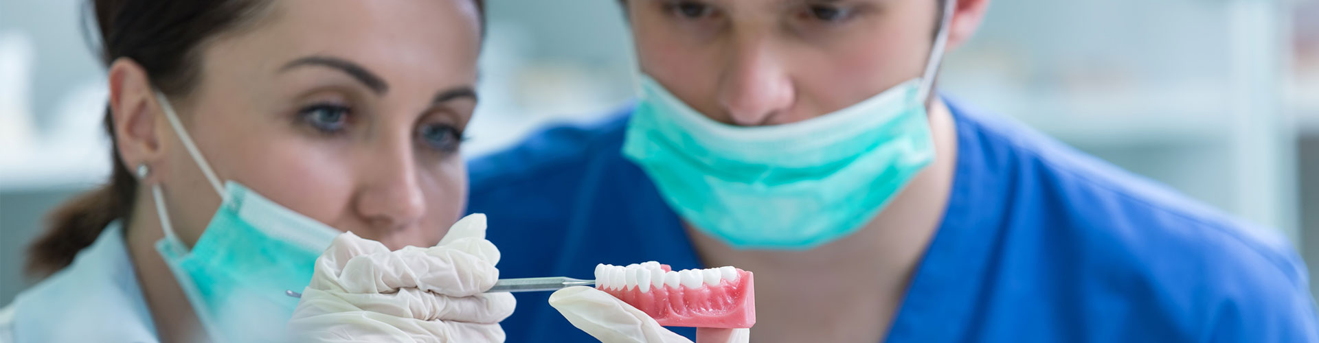 Dental technician working on denture