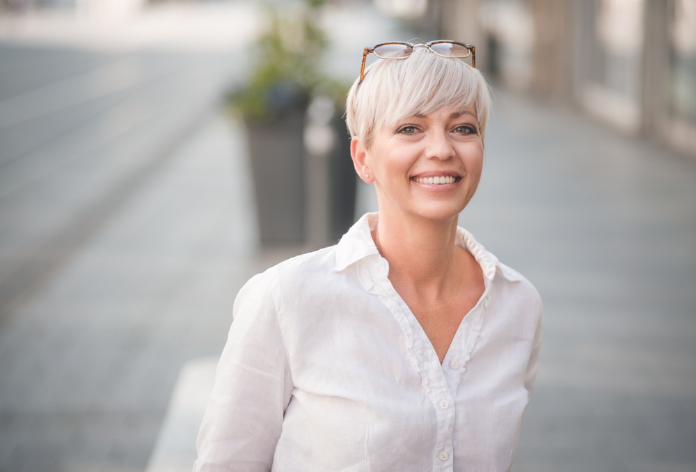 Smiling because of the stress free Payment Methods of the trusted Briglia Dental Group in West Chester PA