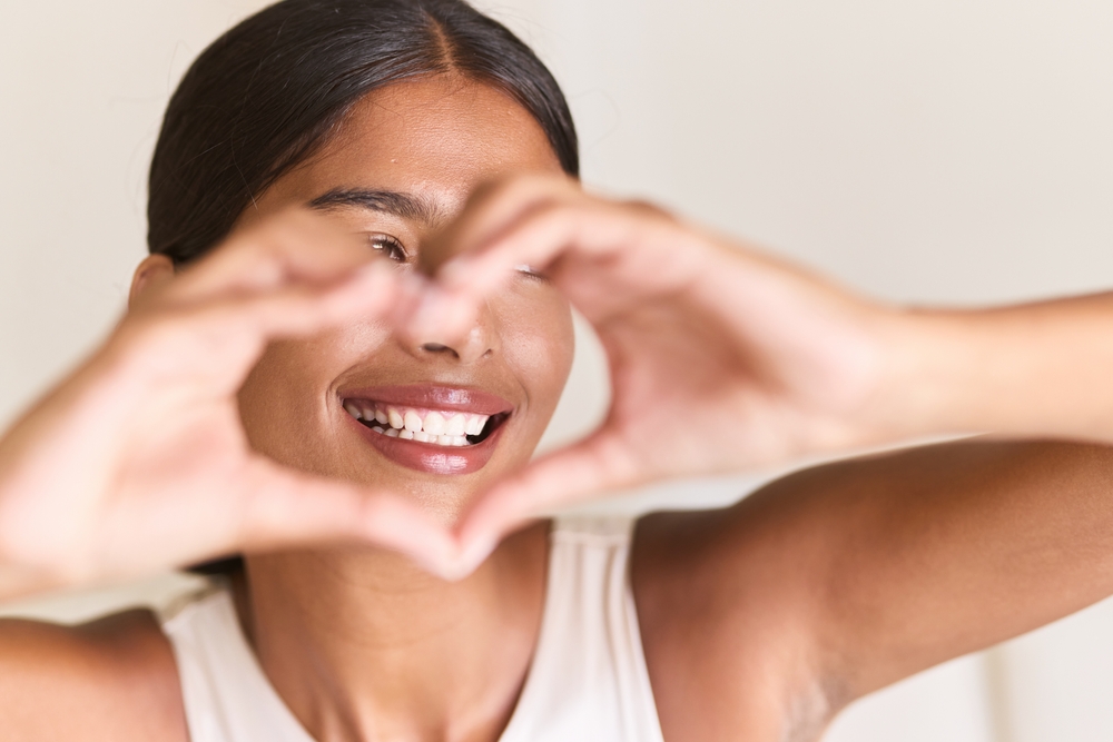 Girl loving her confident smiles after getting a Cosmetic Dental Bonding in West Chester PA
